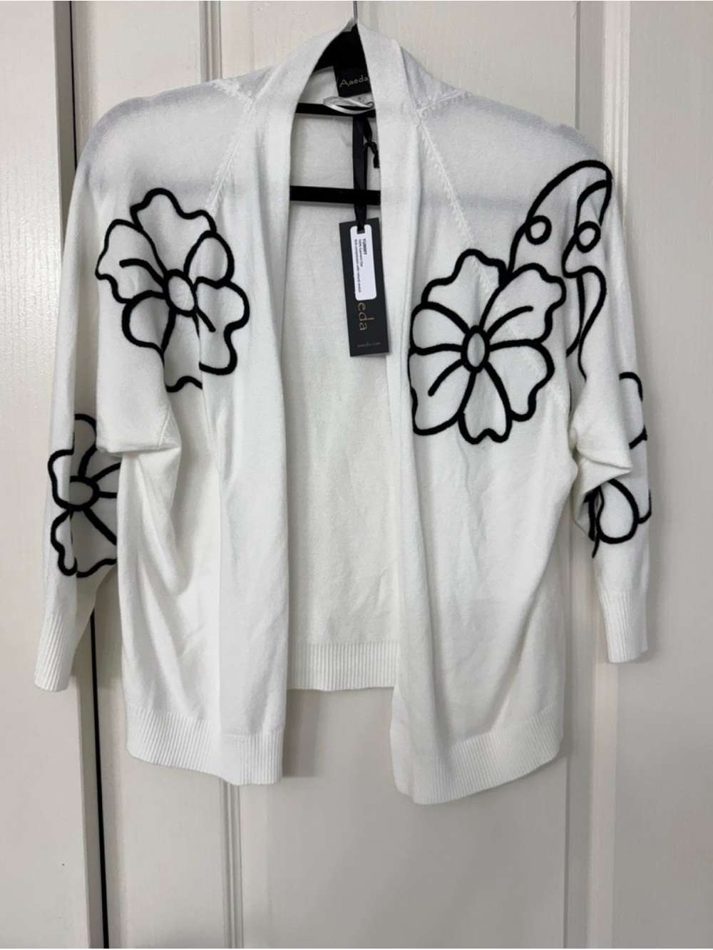 White Floral Open-Front Women's Sweater Cardigan. Only 1 left in a size Medium.